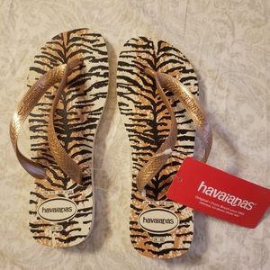 Havianas gold animal print flip flops, size 9